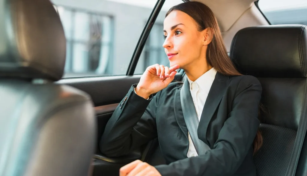 NYC Limo Articles 5 Executive riding comfortably in a luxury limousine, showcasing ZechionRide’s corporate and executive transportation services in NYC.