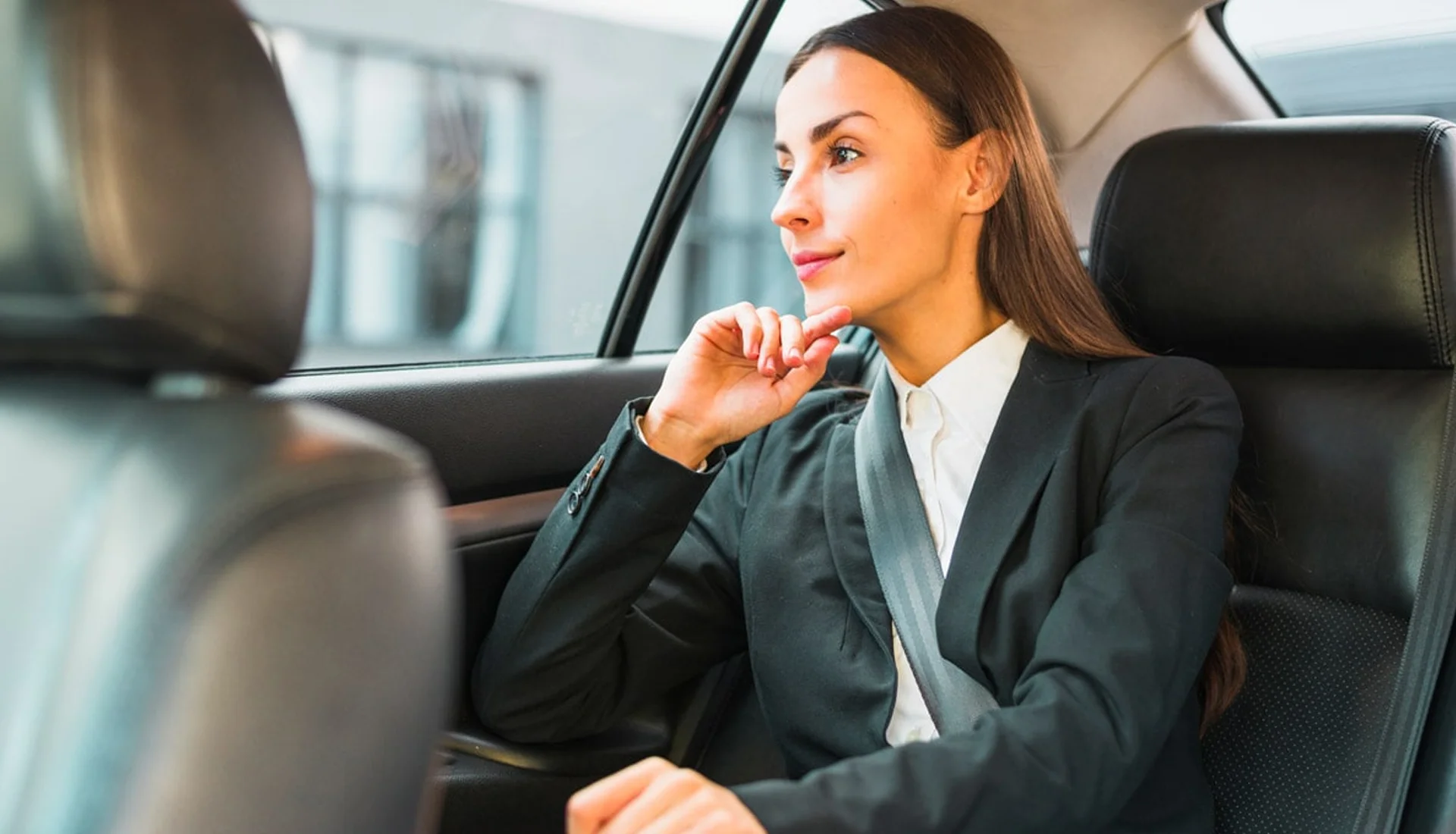 Executive riding comfortably in a luxury limousine, showcasing ZechionRide’s corporate and executive transportation services in NYC.