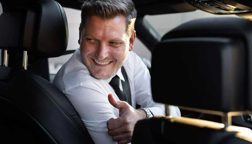 NYC Limo Articles 7 File name: Limousine-Chauffeur-Checking-the-Passengers.webp