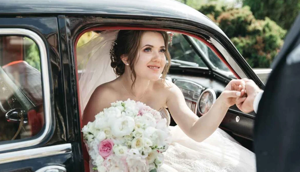 NYC Limo Articles 9 Bride making her wedding entrance from a limousine, showcasing ZechionRide’s luxury wedding transportation services in NYC.