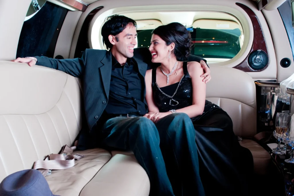 Man and woman enjoying a romantic moment together in a limousine, on their anniversary