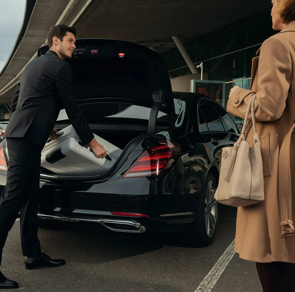 Airport Transfers 7 Man in a black suit, representing luxury airport transfer services in New York City
