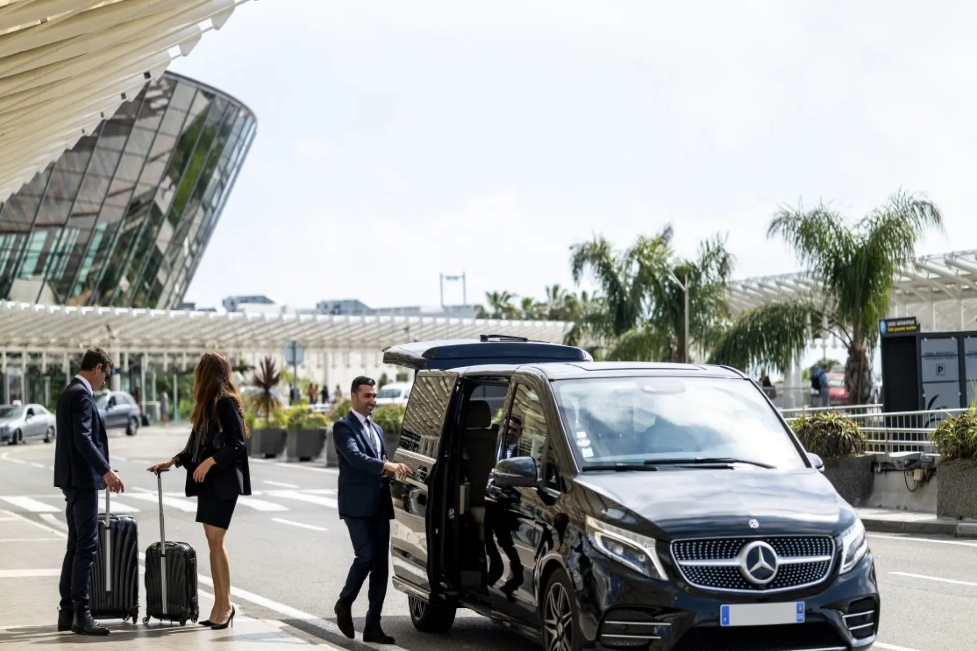 NYC Airport Transfers with ZechionRide – Reliable, Premium & Stress-Free Travel (2025 Guide) 1 Mercedes-Benz V-Class limousine parked at the airport, ready for luxury transportation services
