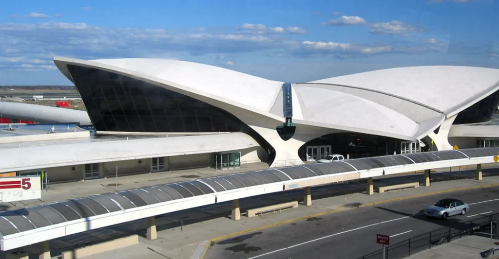 Spacious white building situated in the New York and Tri-State Area, highlighting its striking architectural features
